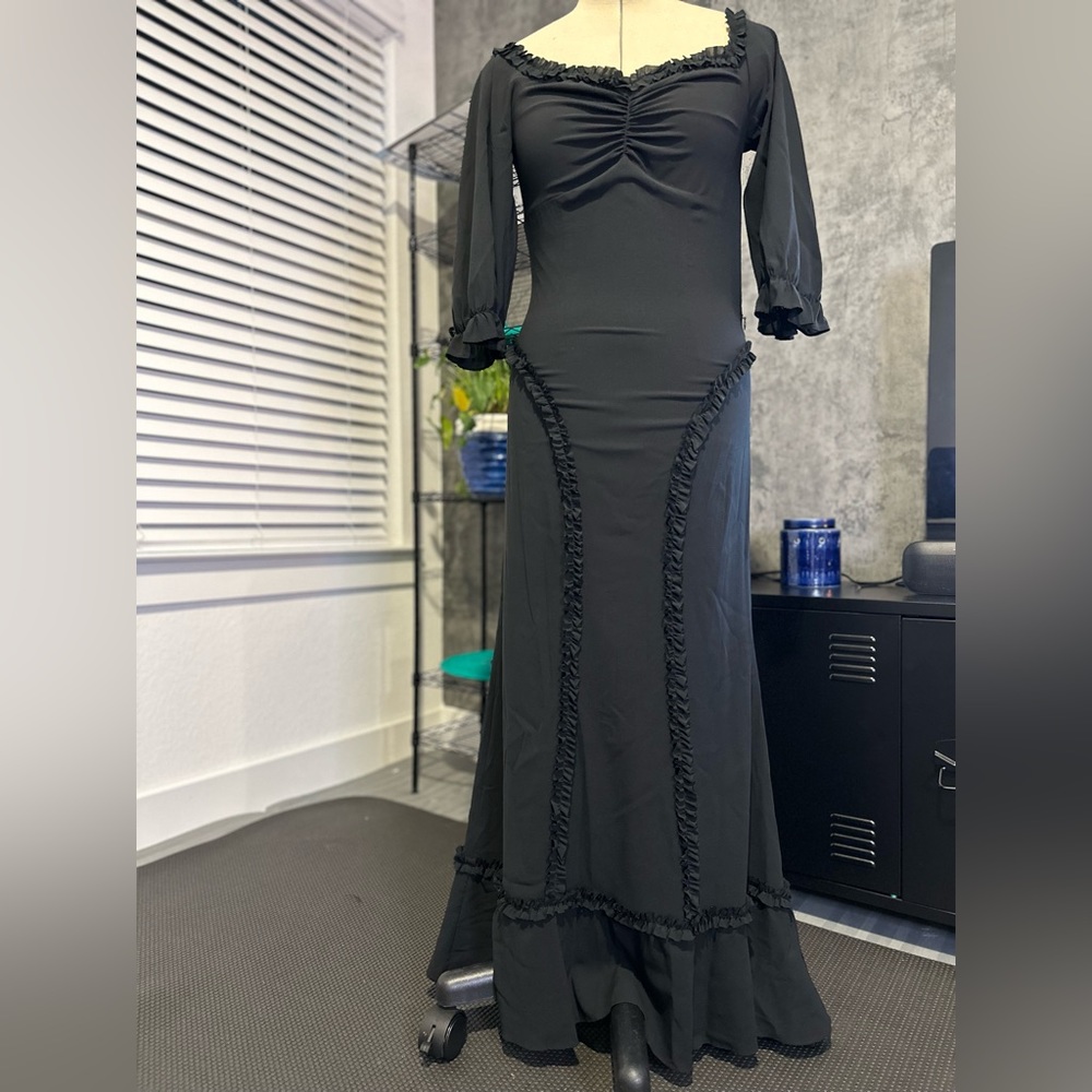 Black mermaid long dress with 3/4 sleeve. Detailed ruffles throughout. S…